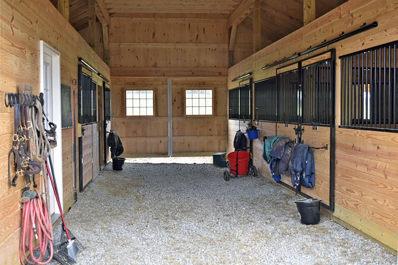 Inside this Modular Horse Barn Showing Stall Fronts.