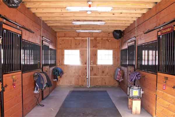 Inside Modular Horse Barn: Twelve Foot Aisle and Stall Fronts